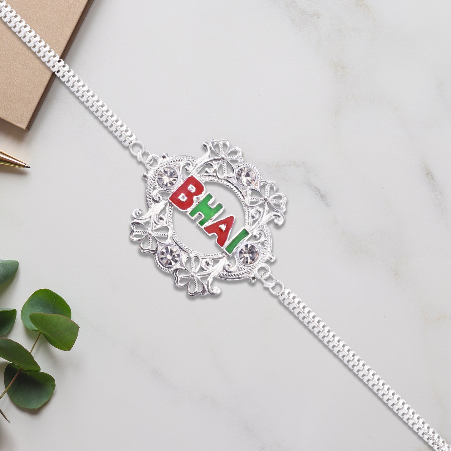 Silver Bhai Rakhi With Floral Frame