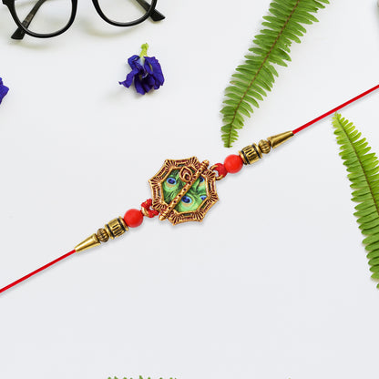 Silver Plated Floral Rakhi With Red  Green Stones