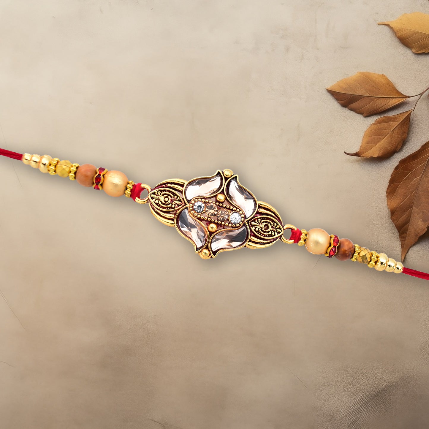 Elegant Floral Designer Rakhi With Gold-toned Beads  Red Thread