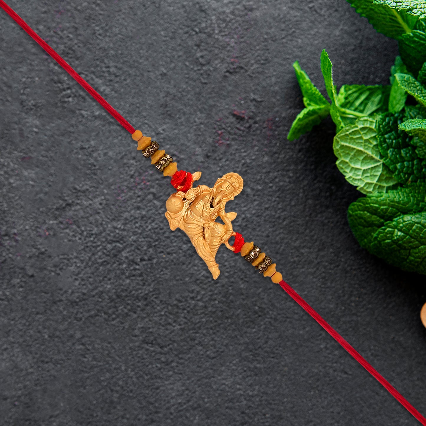 Lord Ganesha Rakhi With Beaded Thread