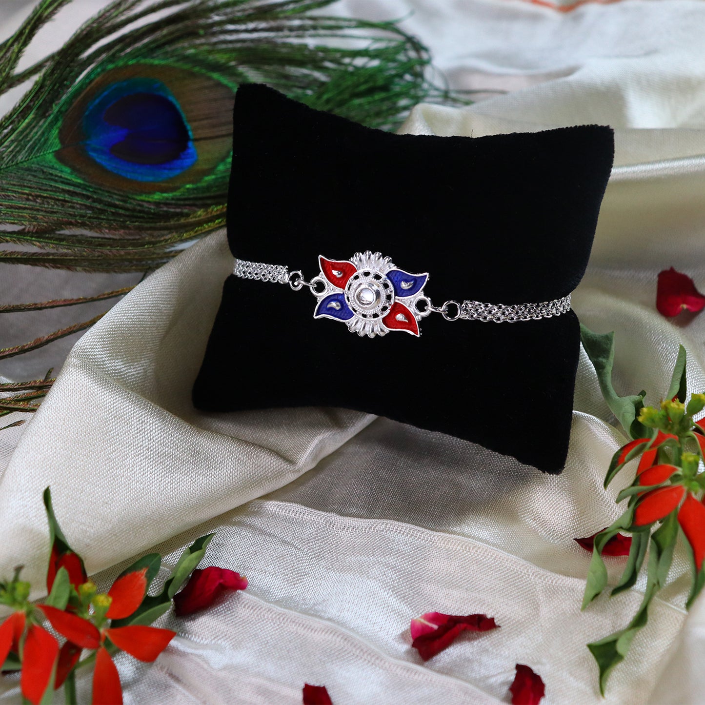 Stylish Sun Design Rakhi With Red-blue Enamel And Silver-tone Metal Chain