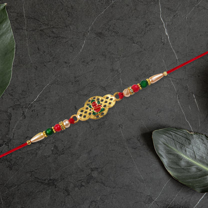 Religious Ganesha Rakhi In Gold Finish
