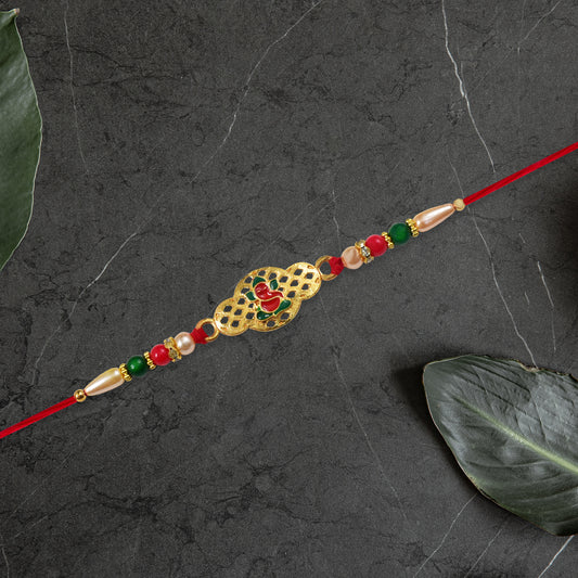 Religious Ganesha Rakhi In Gold Finish