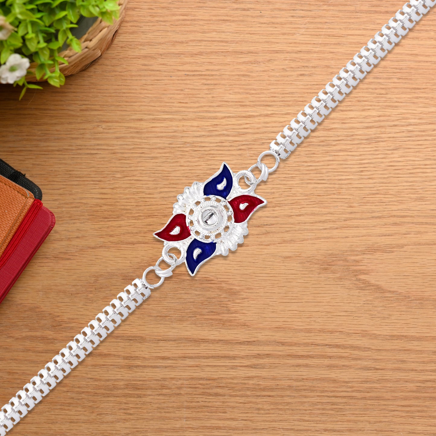 Stylish Sun Design Rakhi With Red-blue Enamel And Silver-tone Metal Chain