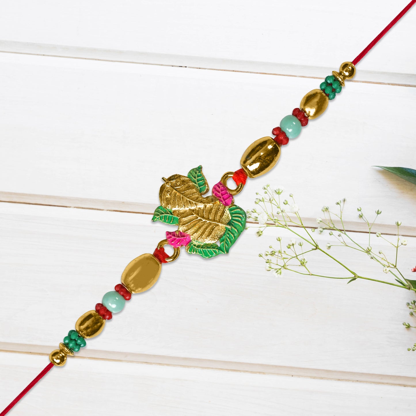 Golden Leaf Design Rakhi With Multicolor Beads