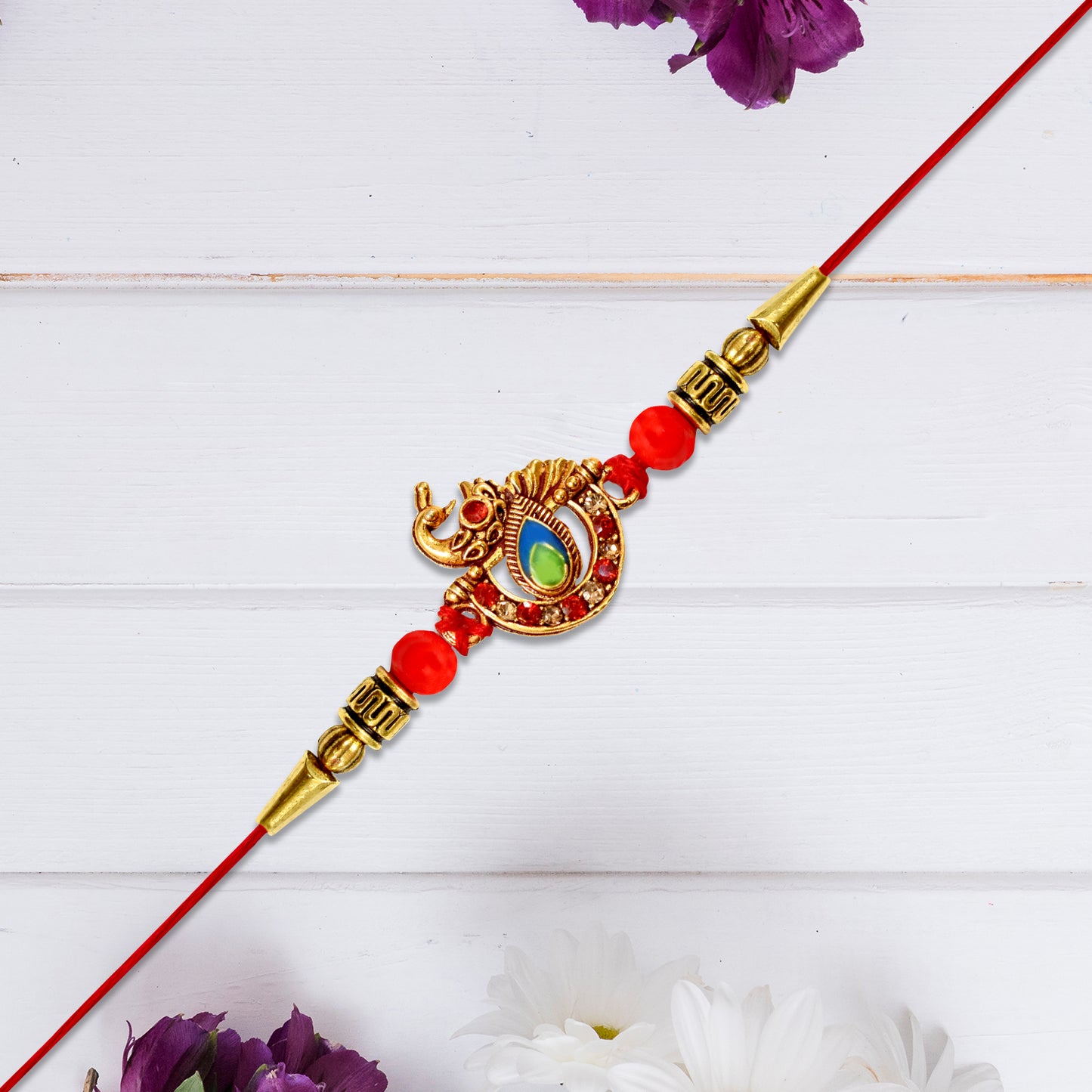 Golden Peacock Rakhi With Red Beads